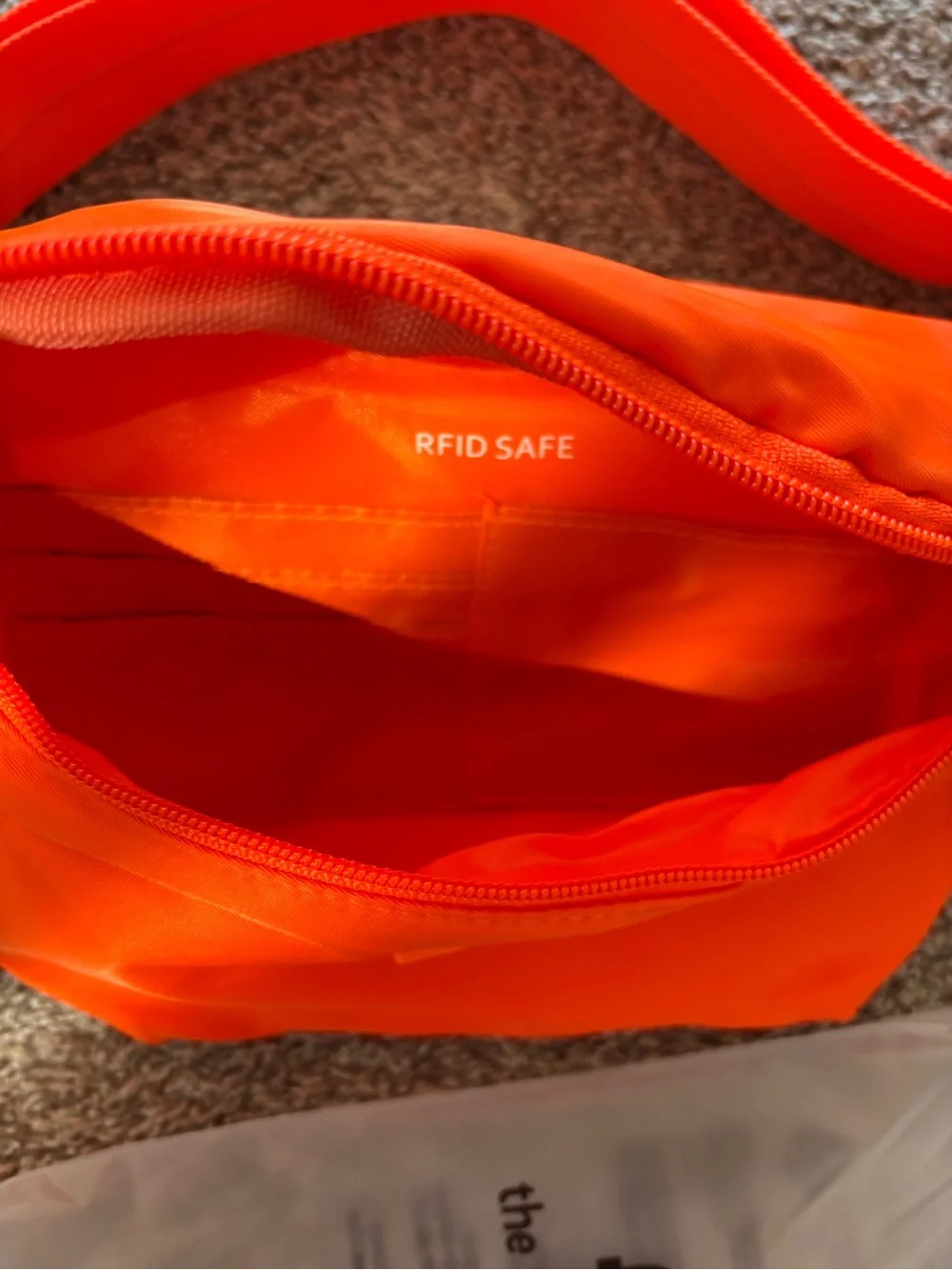 NWT The Foldie Orange Crossbody Bag/Fanny Pack/Travel Bag RFID safe wallet